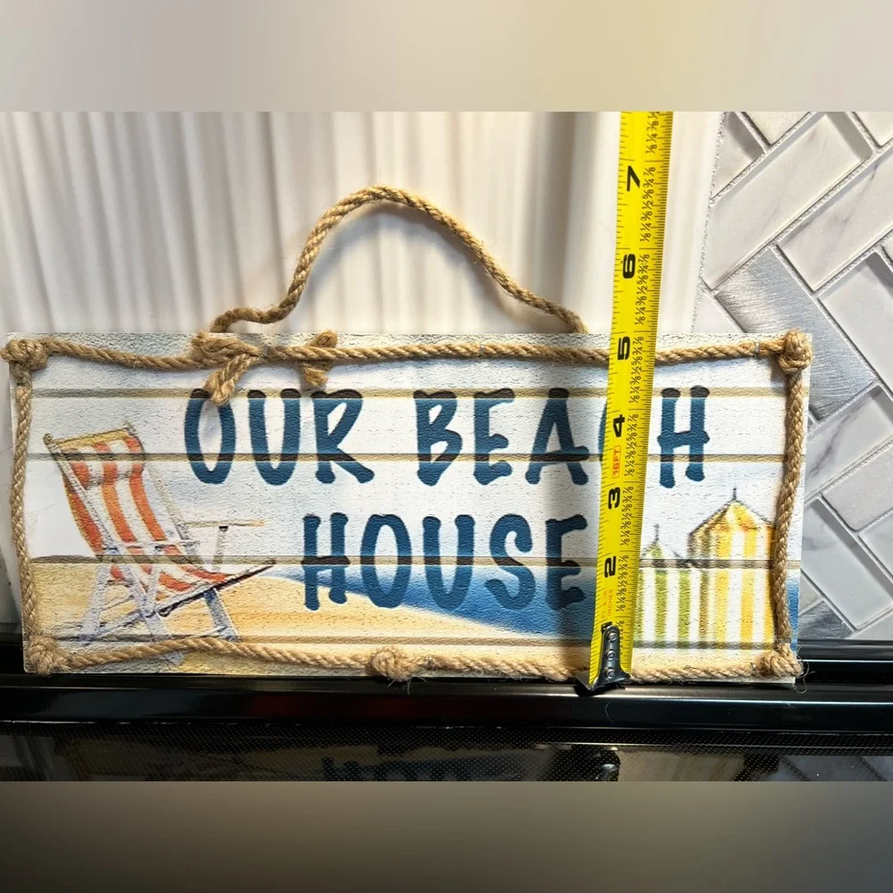 Wooden Beach House with rope sign